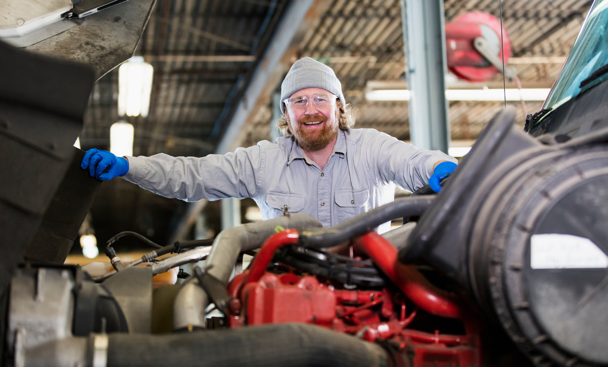 Mechanic working on heavy duty truck